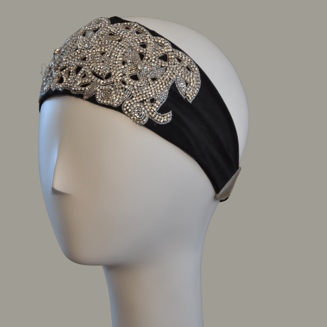 Hand embroidered ivory and silver crystal headband with elastic back.