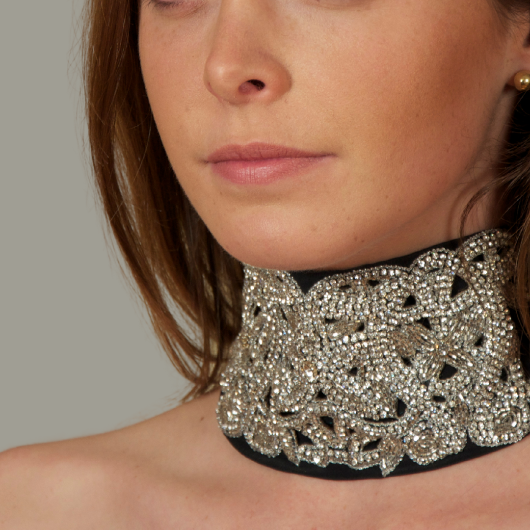 Hand embroidered black and silver crystal headband with elastic back.