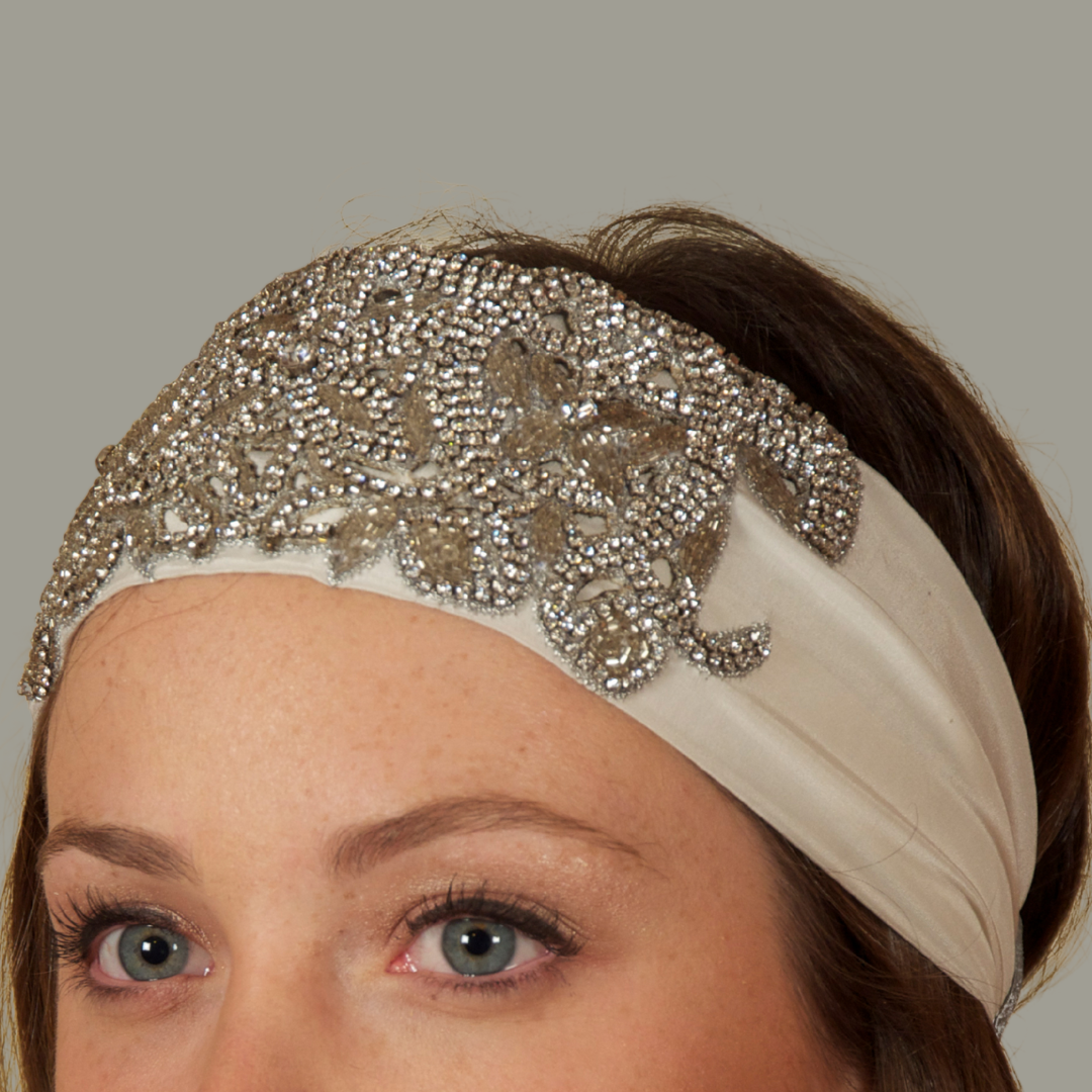 Hand embroidered ivory and silver crystal headband with elastic back.