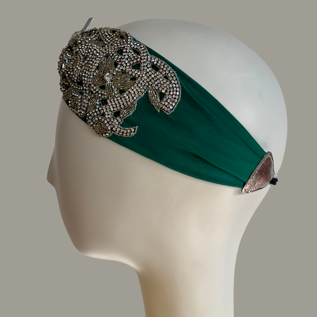 Hand embroidered ivory and silver crystal headband with elastic back.