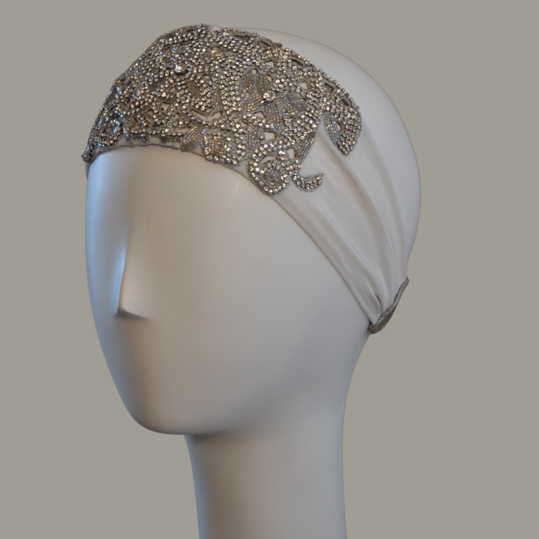 Hand embroidered ivory and silver crystal headband with elastic back.
