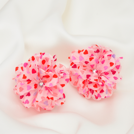 PRIAMBLE™ Blossom Audio Earrings product shot with heart petal overlay by PERIPHERII