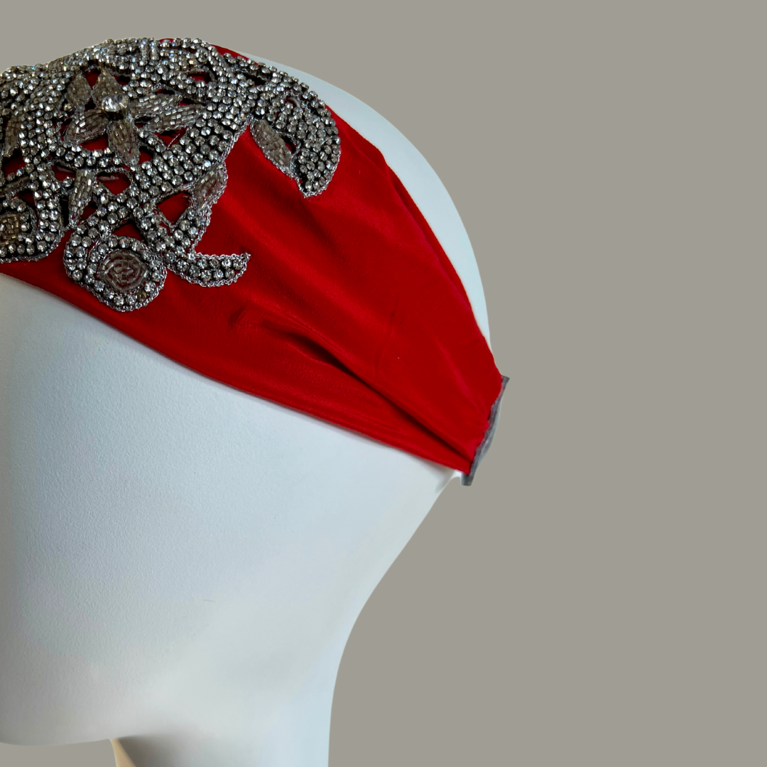 Hand embroidered red and silver crystal headband with elastic back.