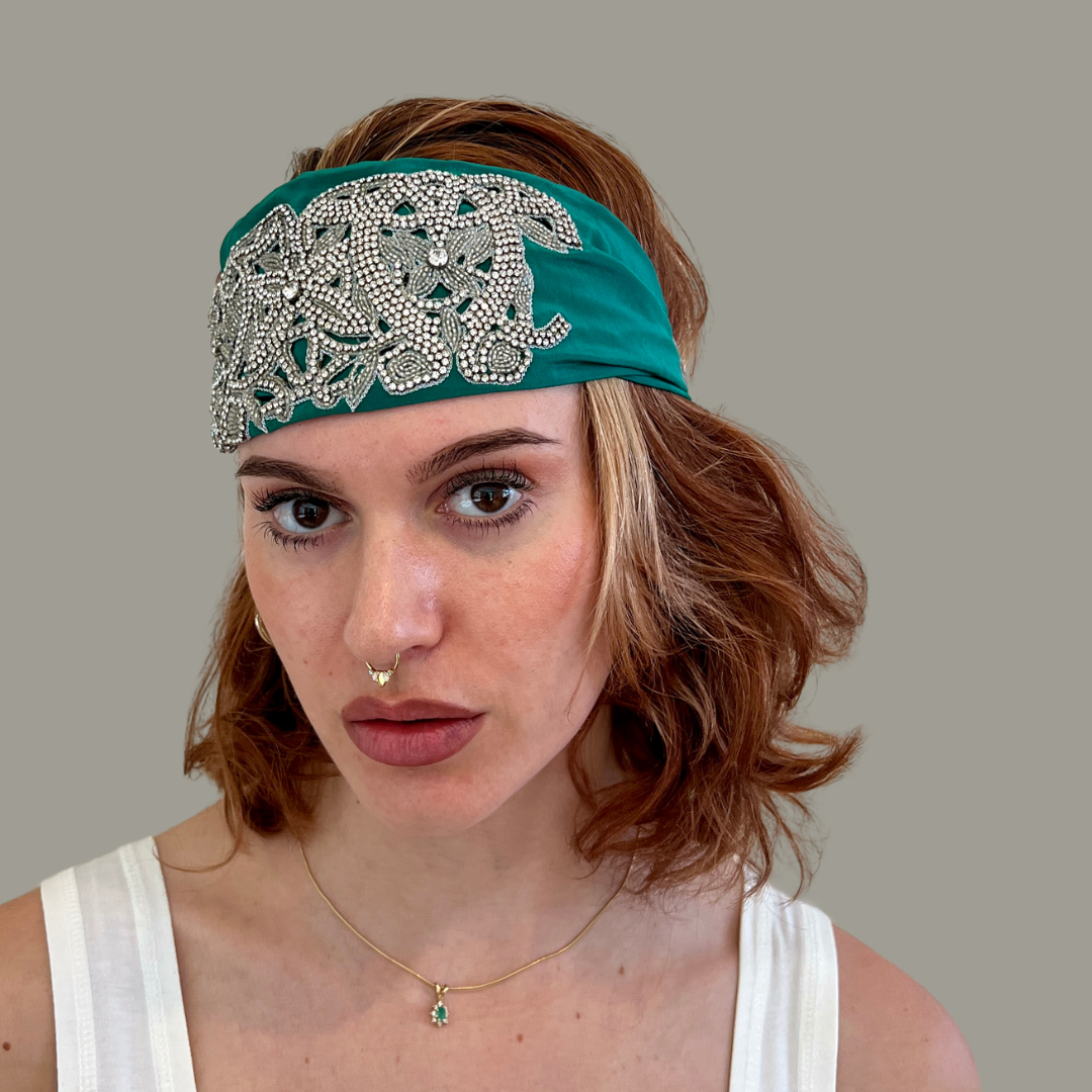 Hand embroidered green and silver crystal headband with elastic back.