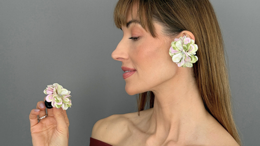 Model wearing Priamble™ Blossom audio earrings by PERIPHERII, floral Bluetooth® open-ear earrings in Ivory Mix, shown in profile