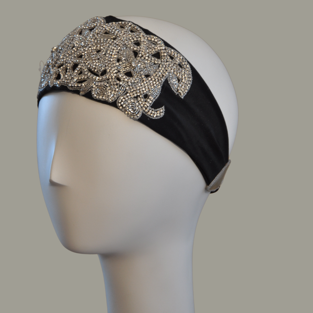 Hand embroidered ivory and silver crystal headband with elastic back. 