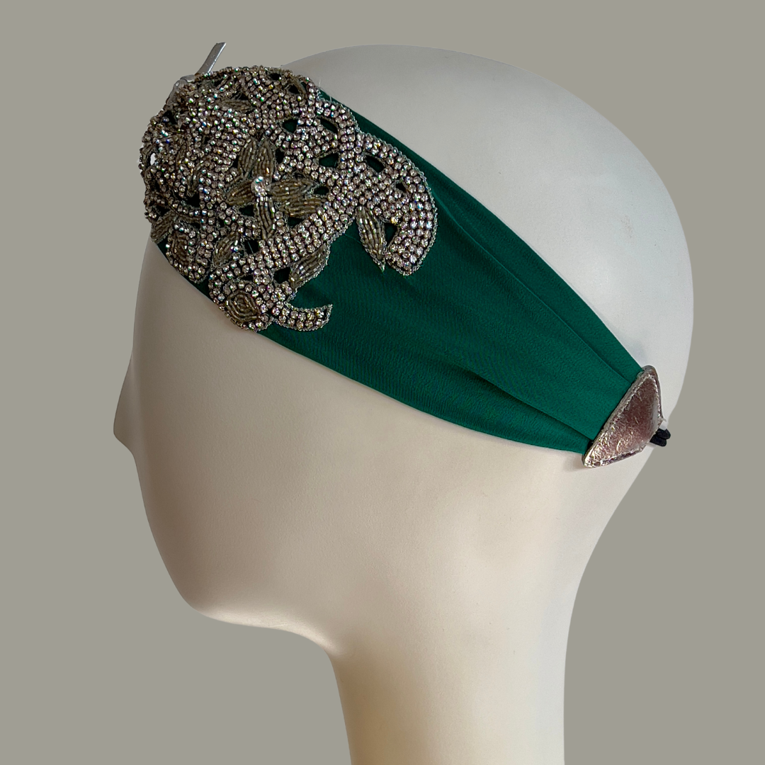 Hand embroidered ivory and silver crystal headband with elastic back. 