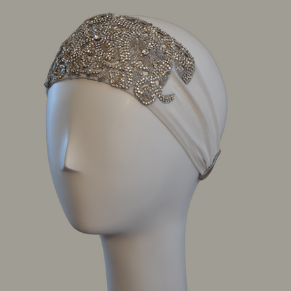 Hand embroidered ivory and silver crystal headband with elastic back. 