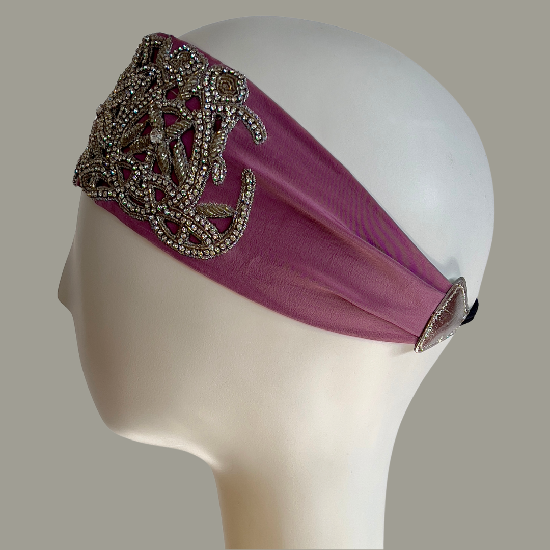 Hand embroidered lavender and silver crystal headband with elastic back. 