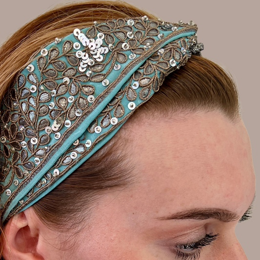 Asymmetric high-end blue headband with elastic back