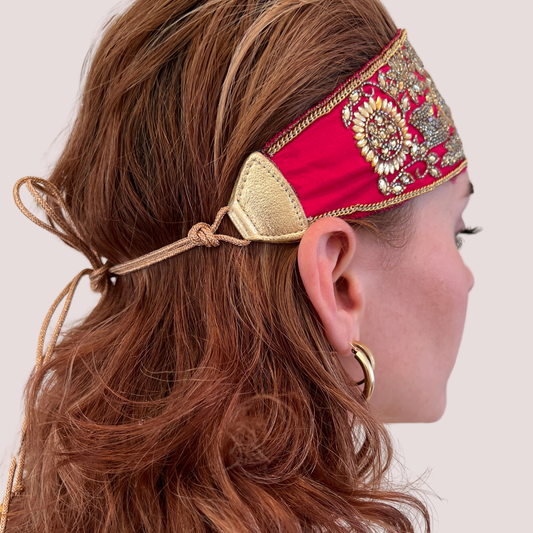 PERIPHERII The Goddess floral hand-embroidered headband in Fuchsia— gold embroidery tie-back view