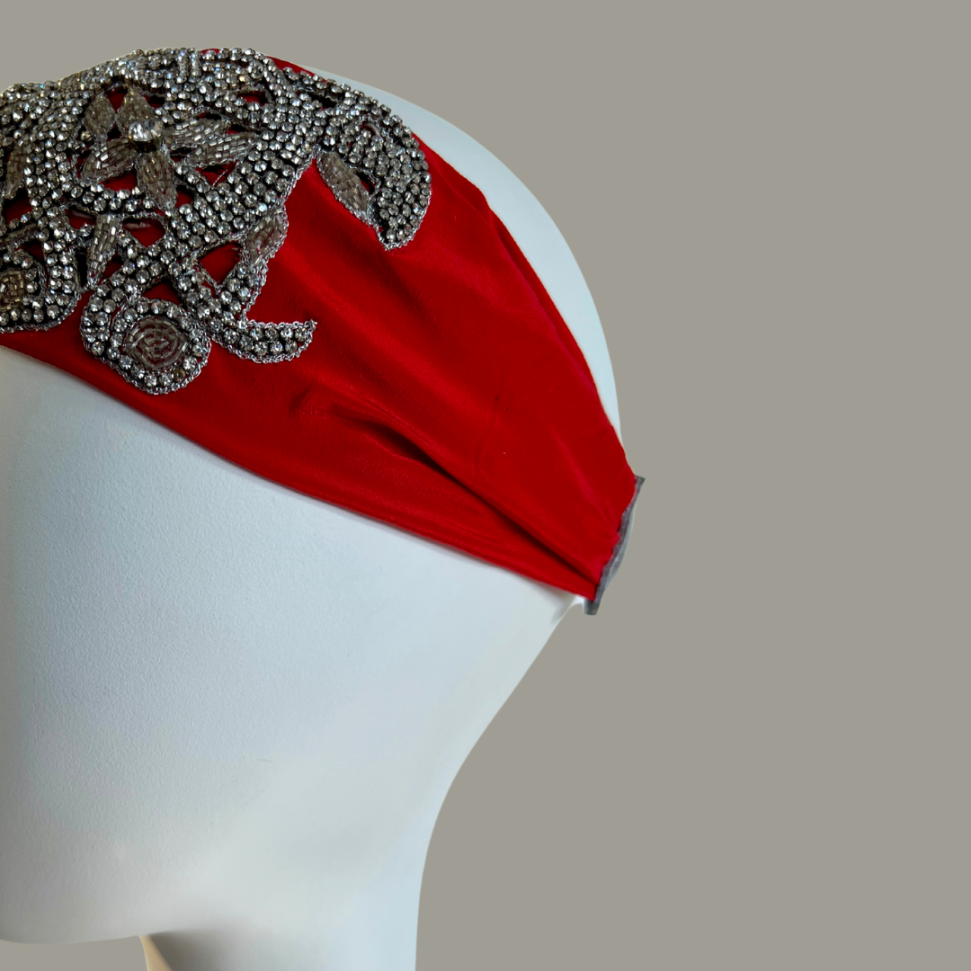 Hand embroidered red and silver crystal headband with elastic back. 