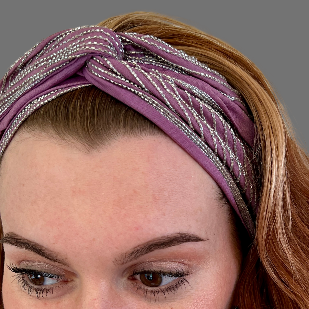 Woman in silver and lavender bugle bead embroidered headband by Peripherii