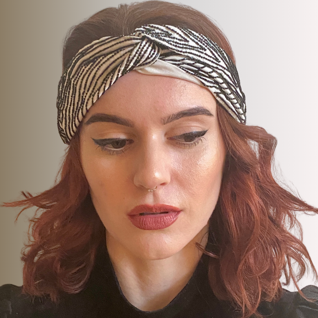 Woman in black and white bugle bead embroidered headband by Peripherii